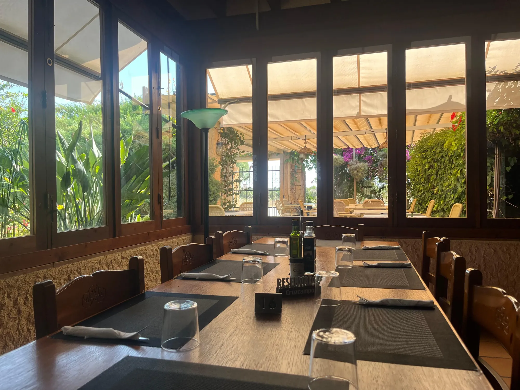Glass-walled dining room looking onto the garden