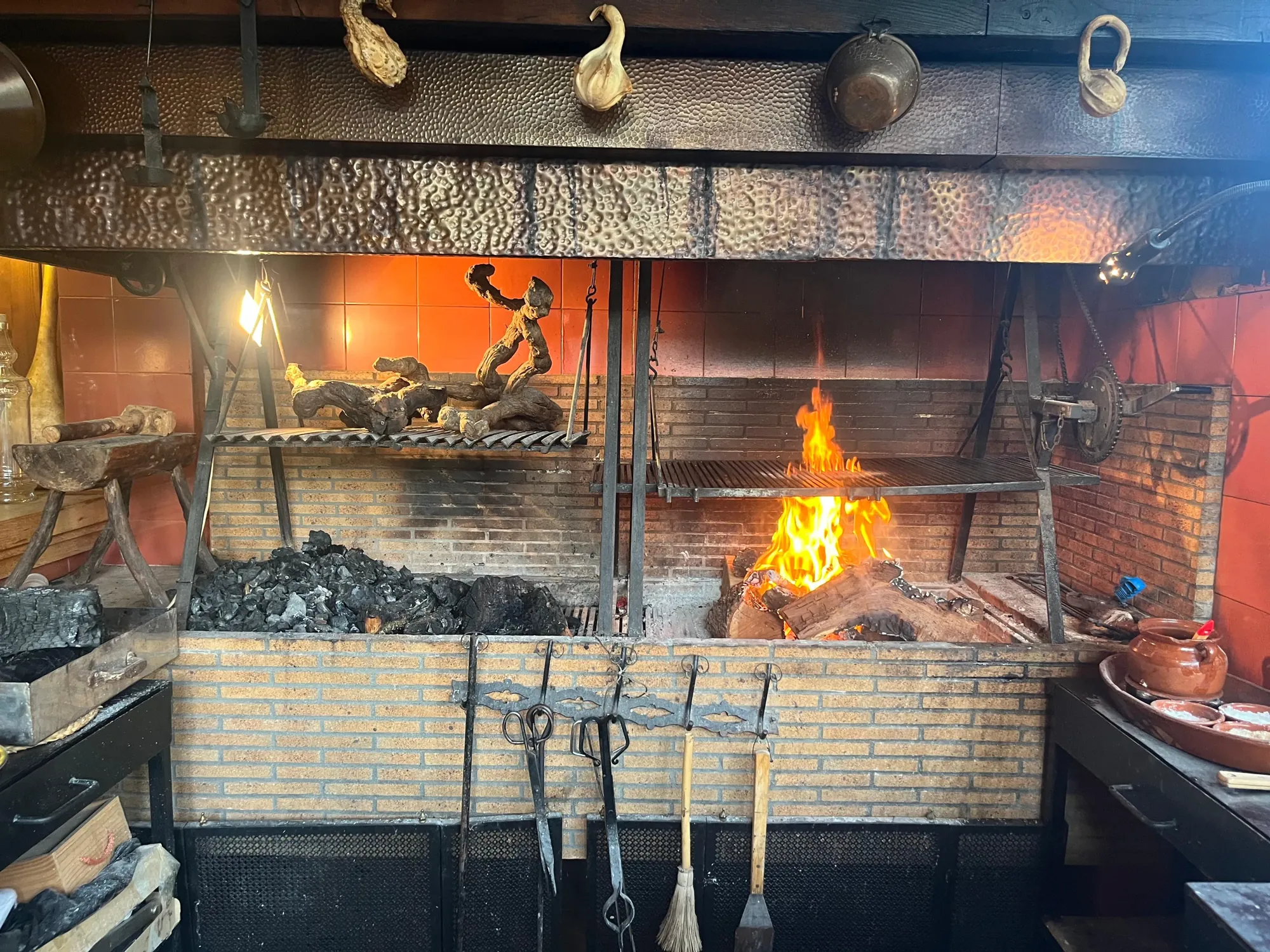 Wood-fired grill alight in the Can Miraet kitchen